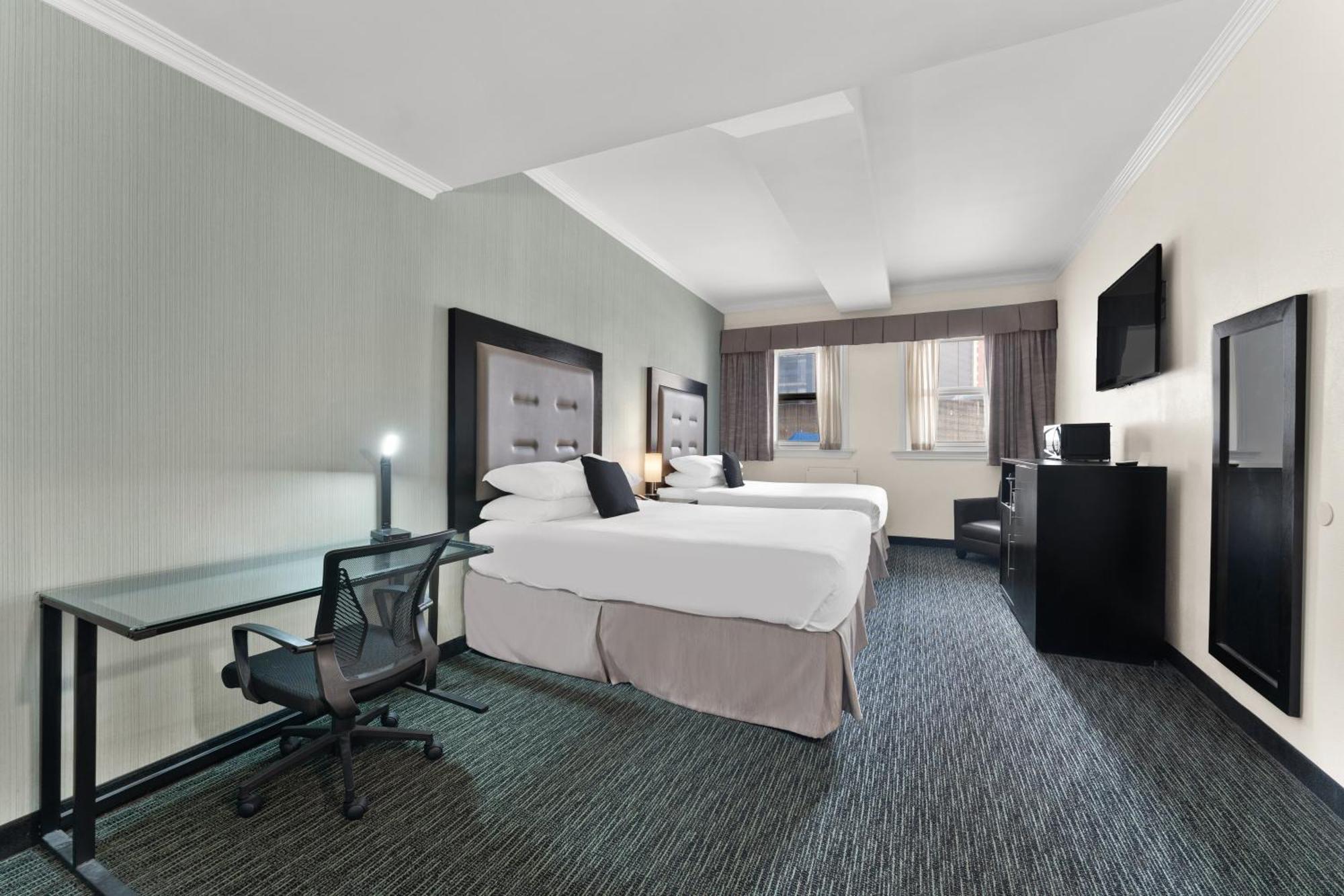 Efficiency Quadruple Room Two Queen Beds Non Smoking